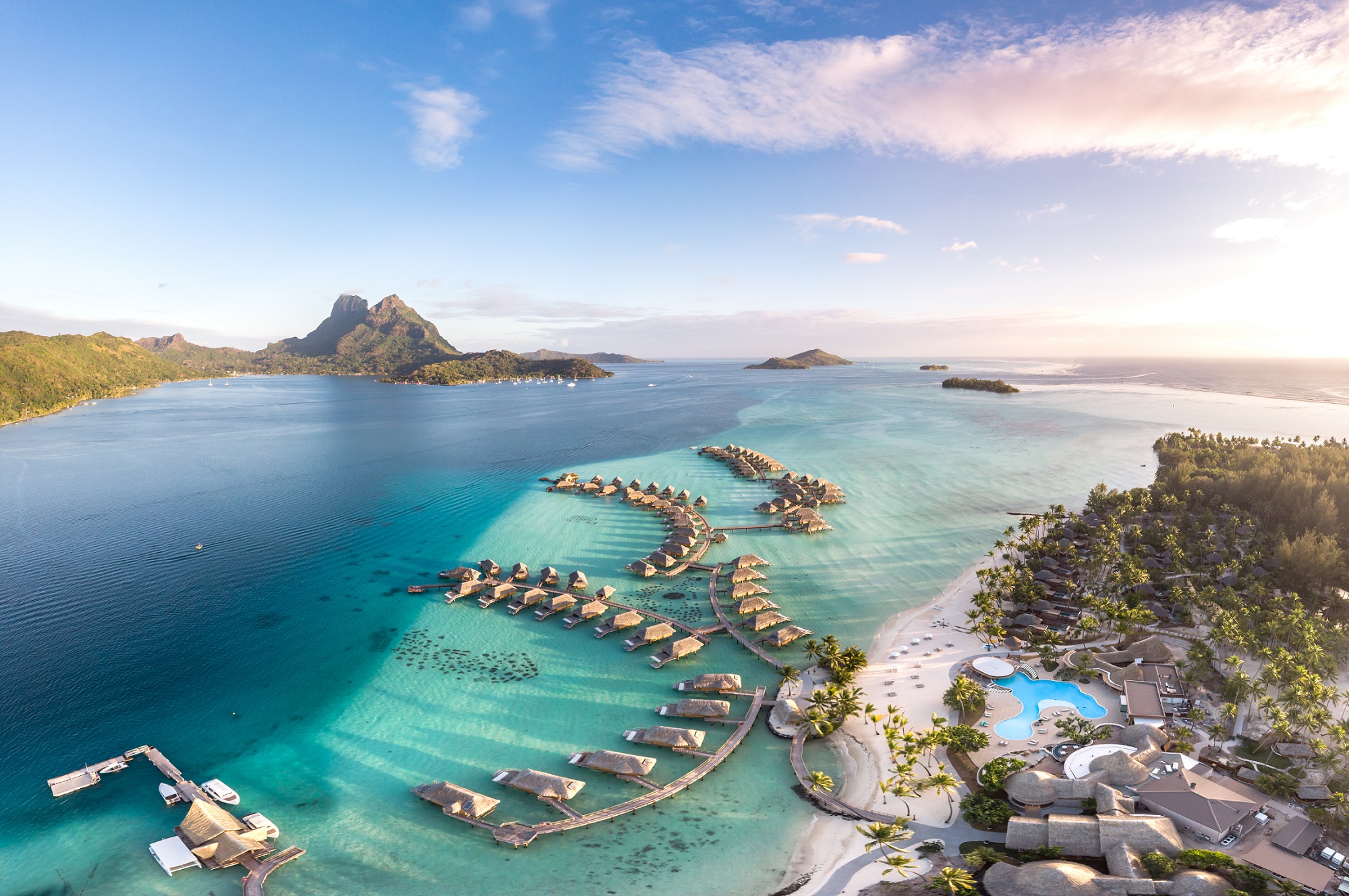 | Blue Tahiti Travel Bora Bora Pearl Resort, Offering Luxurious Overwater Bungalows and Stunning Lagoon Views, Featured in Exclusive All-inclusive Tahiti Honeymoon Deals for Ultimate Romance.