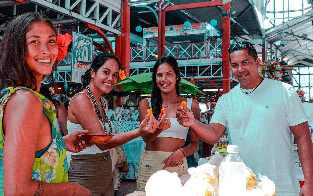 | Blue Tahiti Travel Tahitian Locals Browsing Fresh Produce and Handmade Crafts at Papeete Market