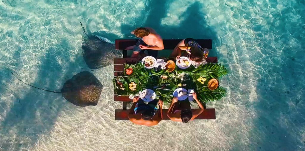 | Blue Tahiti Travel Resort Activities at Le Bora Bora by Pearl Resorts, Including Snorkeling, Paddleboarding, and Cultural Experiences in a Stunning Polynesian Island Setting.